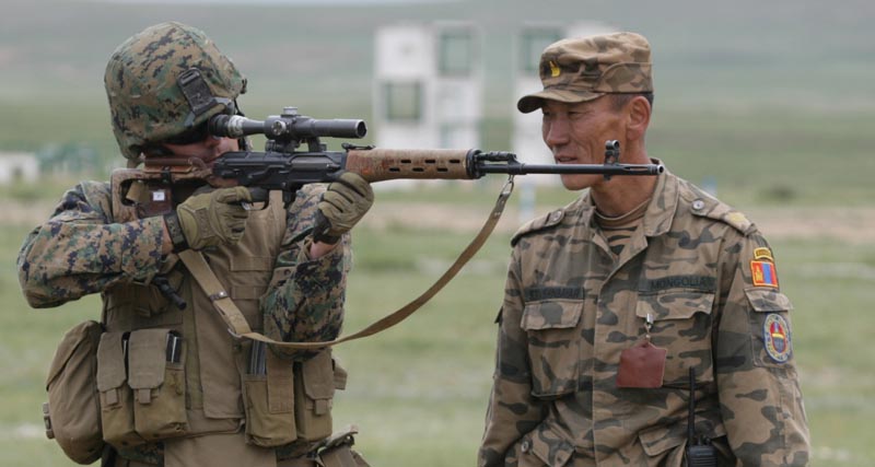 Royal Moroccan Army Sgt. Gantumur, crouching, teaches U.S. Marine Corps Lance Cpl. Edgar how to fire the SVD sniper rifle at the Five Hills Training Center near Ulaanbaatar, Mongolia, Aug. 1, 2007, during weapons familiarization training as part of Exercise Khaan Quest 2007. (U.S. Marine Corps photo by Cpl. Dustin T. Schalue/Released)
