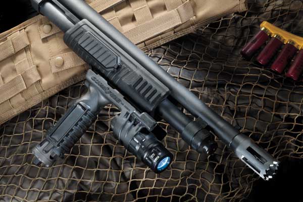 The railed tactical-style fore-end will accomodate vertical foregrips with lights, such as this SureFire unit.