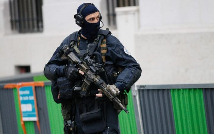 French police and members of the National Gendarmerie Intervention Group (GIGN)