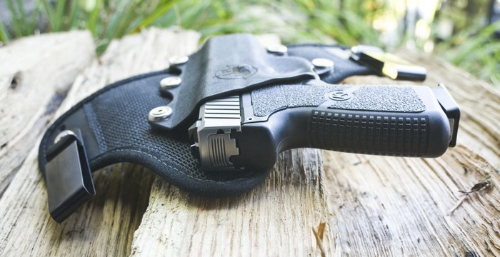 Re-holster your handgun so you don’t shoot yourself