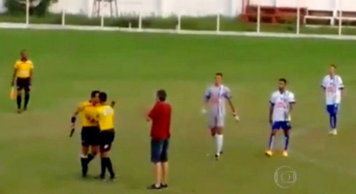 Brazilian football referee pulls GUN on the pitch after row over red card
