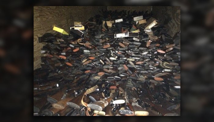 Man arrested after nearly 10,000 stolen guns found in his house