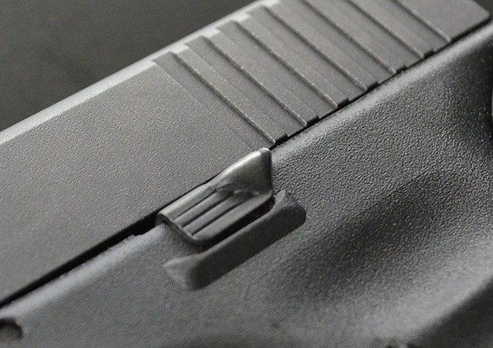 Кнопка сброса затворной задержки пистолета Glock