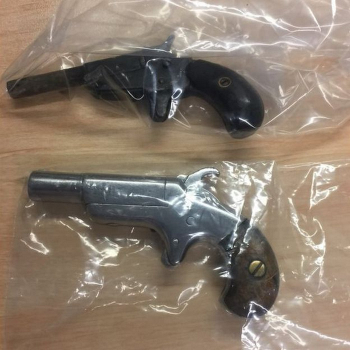 A man in Brisbane, Queensland, been charged with unlawfully possessing two handguns