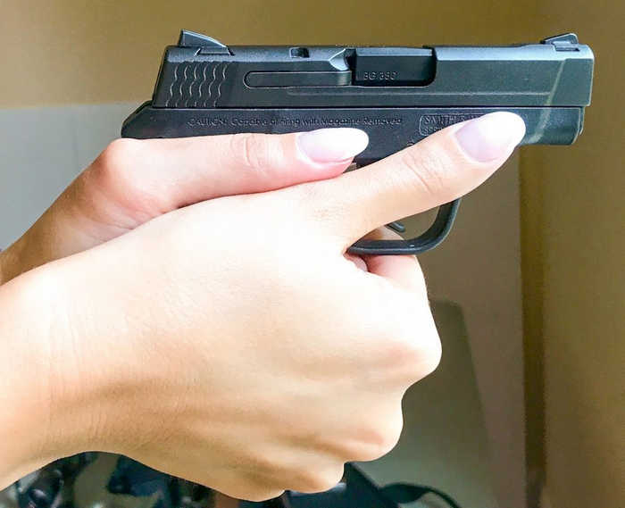 How to hold a small pistol with large hands 